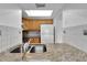 Bright kitchen features granite countertops, stainless steel sink, and wood cabinets at 4600 Marine Parkway # 104, New Port Richey, FL 34652