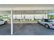 Covered parking area for condo residents with numbered spaces at 4600 Marine Parkway # 104, New Port Richey, FL 34652