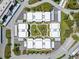 Aerial view of a community of condo buildings with parking and green areas at 4600 Marine Parkway # 104, New Port Richey, FL 34652
