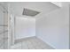 Small storage or pantry room with glass shelving at 4600 Marine Parkway # 104, New Port Richey, FL 34652
