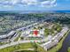 Wide aerial view of condo building and its surroundings, near water at 4600 Marine Parkway # 104, New Port Richey, FL 34652