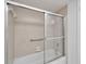 Bathroom with shower/tub and sliding glass door at 4600 Marine Parkway # 104, New Port Richey, FL 34652