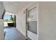 Condo building exterior entryway with a security door at 4600 Marine Parkway # 104, New Port Richey, FL 34652