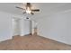 Bright bedroom with ceiling fan, laminate flooring and ample closet space at 4600 Marine Parkway # 104, New Port Richey, FL 34652