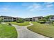Community features lush landscaping, walkways, and a courtyard at 4600 Marine Parkway # 104, New Port Richey, FL 34652
