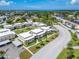 Aerial view of condo building and its surroundings, including road and water at 4600 Marine Parkway # 104, New Port Richey, FL 34652