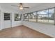 Bedroom with laminate flooring, ceiling fan, and sliding glass doors at 4600 Marine Parkway # 104, New Port Richey, FL 34652