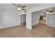 Bedroom with laminate flooring, ceiling fan and view into kitchen at 4600 Marine Parkway # 104, New Port Richey, FL 34652