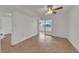 Bright bedroom with laminate wood flooring and sliding glass doors to a patio at 4600 Marine Parkway # 104, New Port Richey, FL 34652