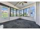 Spacious Florida room with plenty of windows and a view of the backyard at 37601 Neukom Ave, Zephyrhills, FL 33541