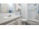 Second bathroom with single vanity and tub shower at 37601 Neukom Ave, Zephyrhills, FL 33541