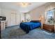 Spacious main bedroom with a double bed and ample closet space at 37601 Neukom Ave, Zephyrhills, FL 33541