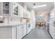 Bright and airy kitchen with white cabinets and modern appliances at 37601 Neukom Ave, Zephyrhills, FL 33541