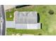 Aerial view of a single-story home with a carport and well-maintained lawn at 37601 Neukom Ave, Zephyrhills, FL 33541
