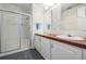 Clean bathroom with double vanity and a shower/tub combo at 37601 Neukom Ave, Zephyrhills, FL 33541