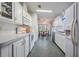 Efficient kitchen with white cabinets and appliances at 37601 Neukom Ave, Zephyrhills, FL 33541