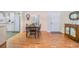 Bright dining area with hardwood floors and kitchen access at 37601 Neukom Ave, Zephyrhills, FL 33541