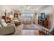 Relaxing living room with wood furniture and carpet flooring at 37601 Neukom Ave, Zephyrhills, FL 33541