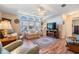 Comfortable living room with hardwood floors and lots of natural light at 37601 Neukom Ave, Zephyrhills, FL 33541