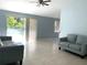 Bright living room featuring tile floors and two couches at 3275 Fox Lake Dr, Tampa, FL 33618