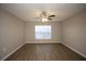 Spacious living room with neutral walls, laminate flooring, and a ceiling fan at 5239 Tummel Ct, Wesley Chapel, FL 33545