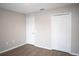 Simple bedroom with double doors and light walls at 5239 Tummel Ct, Wesley Chapel, FL 33545