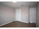 Simple bedroom with neutral walls, double-door closet and wood-look flooring at 5239 Tummel Ct, Wesley Chapel, FL 33545