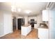 Spacious kitchen with white cabinets, granite countertops, and stainless steel appliances at 5239 Tummel Ct, Wesley Chapel, FL 33545