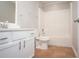 Clean bathroom with tub, toilet, and white vanity at 5239 Tummel Ct, Wesley Chapel, FL 33545