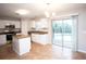 Kitchen with white cabinets, granite countertops, stainless steel appliances, and pool view at 5239 Tummel Ct, Wesley Chapel, FL 33545