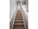 Clean carpeted staircase leading to the upper level of the home at 5239 Tummel Ct, Wesley Chapel, FL 33545
