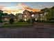 Elegant Tudor style home with stone accents and a brick driveway at 909 Shoals Landing Dr, Brandon, FL 33511