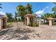 Gated community entrance with a brick paved road and lush landscaping at 909 Shoals Landing Dr, Brandon, FL 33511