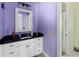Bathroom with a white vanity, black countertop, and a shower at 909 Shoals Landing Dr, Brandon, FL 33511