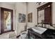 Bathroom with single sink vanity and shower; modern and elegant at 909 Shoals Landing Dr, Brandon, FL 33511