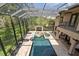 Enclosed pool and spa with lounge chairs; perfect for relaxing and entertaining at 909 Shoals Landing Dr, Brandon, FL 33511