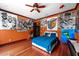 Spacious bedroom with hardwood floors and artwork at 909 Shoals Landing Dr, Brandon, FL 33511