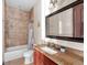 Bathroom with granite vanity and shower/tub combo at 909 Shoals Landing Dr, Brandon, FL 33511