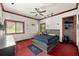 Spacious bedroom with a large bed, ample closet space, and a ceiling fan at 909 Shoals Landing Dr, Brandon, FL 33511