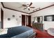 Bright bedroom featuring a comfy bed, dresser, and a large TV at 909 Shoals Landing Dr, Brandon, FL 33511