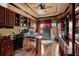 Spacious home office with built-in cabinetry and hardwood floors at 909 Shoals Landing Dr, Brandon, FL 33511
