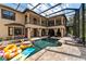Resort-style pool and spa with a covered patio and plenty of space for relaxation at 909 Shoals Landing Dr, Brandon, FL 33511