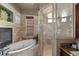 Spa-like bathroom with a large walk-in shower and soaking tub at 909 Shoals Landing Dr, Brandon, FL 33511