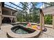 Large screened pool and spa with lounge chairs, surrounded by a spacious patio at 909 Shoals Landing Dr, Brandon, FL 33511