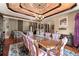 Elegant dining room featuring a large table, chandelier, and hardwood floors at 909 Shoals Landing Dr, Brandon, FL 33511