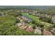 Aerial view of a luxury community featuring houses, golf course, and a pond at 10110 Radcliffe Dr, Tampa, FL 33626