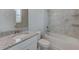 Bathroom with granite countertop, white vanity, and a tub shower combo at 11321 Alachua Creek Ln, Riverview, FL 33579