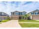 Two-story house with a two-car garage and landscaped front yard at 11321 Alachua Creek Ln, Riverview, FL 33579