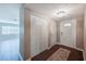 Open entryway featuring tiled floors, a coat closet, and a view into the living area, enhanced by neutral wall colors at 13805 Candidate Pl, Tampa, FL 33613