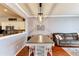 Bright dining area with a farmhouse table and seating for four at 26607 Chimney Spire Ln, Wesley Chapel, FL 33544